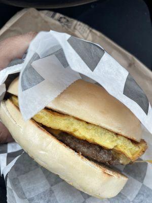 Sausage egg and cheese on a plain bagel