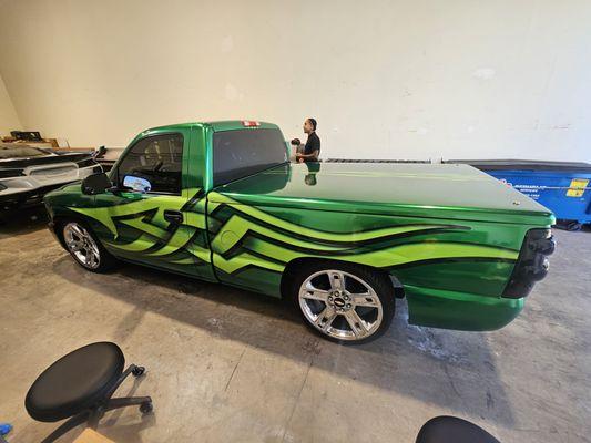 This black truck just got fitted with an amazing green wrap with custom stripes. We love the minitruck style. The customer was so excited.