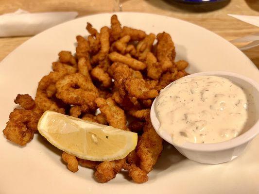 Fried clam strips and tartar sauce.