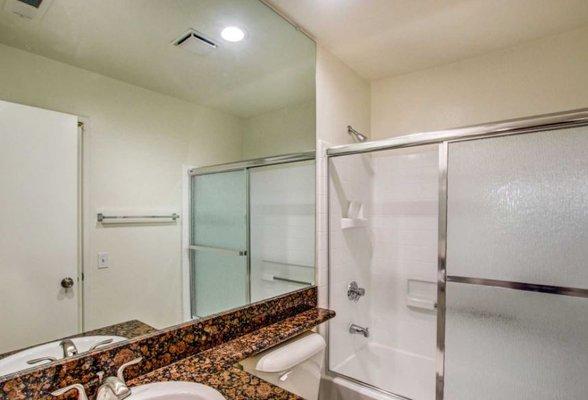 Remodeled Bathrooms with Premium Fixtures, LED Recessed Lights and Counter to Ceiling Mirror.