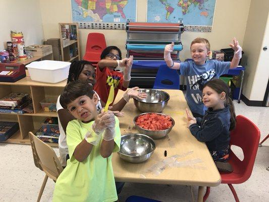 Making fruit popsicles.