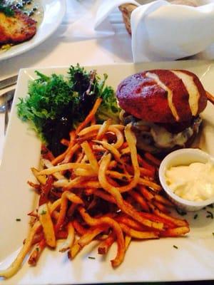 Burger with pretzel bun. Fries were cut fresh by hand. Was very good.