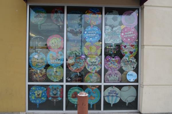 Their east facing window features many mylar balloons.