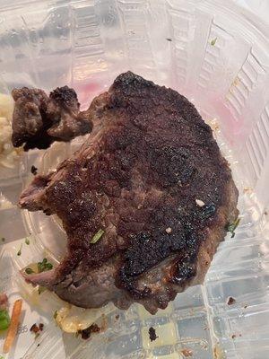 This is what I got.. supposed to be their sirloin 6oz steak. It was burnt on both sides as if it was fried. Tough as if it was old and dry