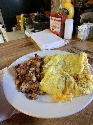 Omelette: cheese, onion, peppers with a side of hash