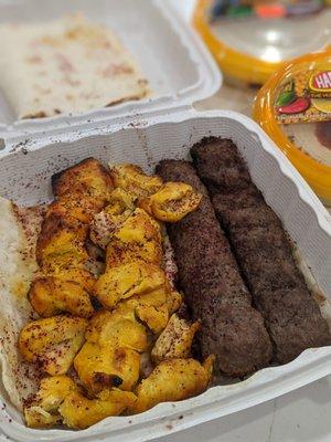 Left: 2 chicken kababs. Right: 2 kubeidehs. Back: baba ghanoush and hummus picked up from the international food bazaar grocery next door.