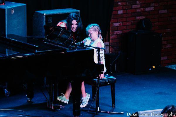 The owner Liz Roos getting a student ready for a performance