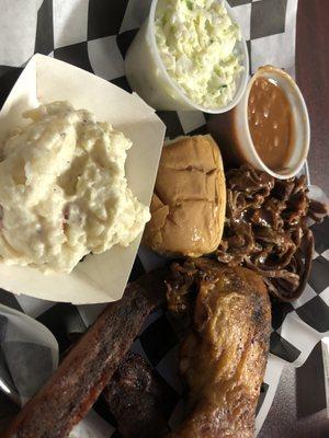 Three meat platter with pulled pork, ribs and smoked chicken