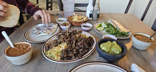 Taco Platter for two. Lots of meat.  Two bowls of flavorful beans.  Plenty of guacamole.