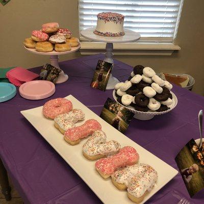 Letter donuts and regulars displayed at party. (Cake from Homeland, black and white donuts are Hostess)