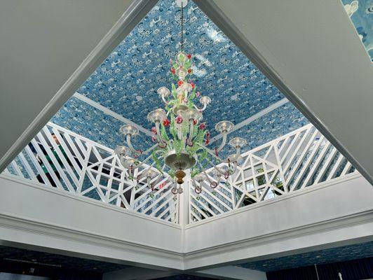 Chandelier hanging between the two levels of the Cupola