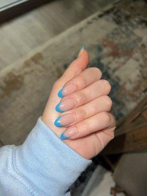 French tip with powder and almond shape. Color was a neon blue