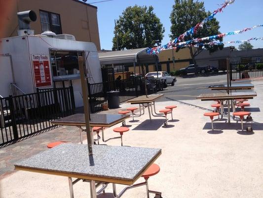 The patio eating area with a food spot.