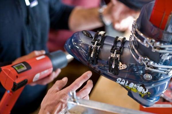 Grizzly's expert boot fitters punching a ski boot. We make custom foot beds, custom liners and boot modifications.