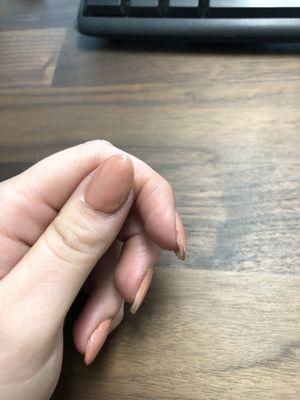 Real nail showing. Edges are uneven.