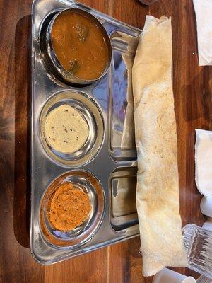 Cheese masala dosa, chutney and sambhar.