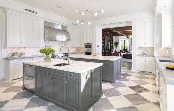 Calacatta Marble Slabs Installed in Kitchen Island and Venetino Marble on Countertops