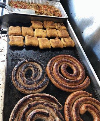 Authentic sweet and spicy Italian sausage, knishes, peppers and onions