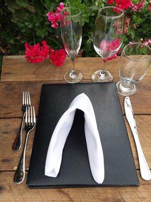 Crystal glasses stand side by side on the table.