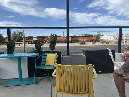 The side patio is very roomy and has a wonderful view of the trains coming in and out of town.