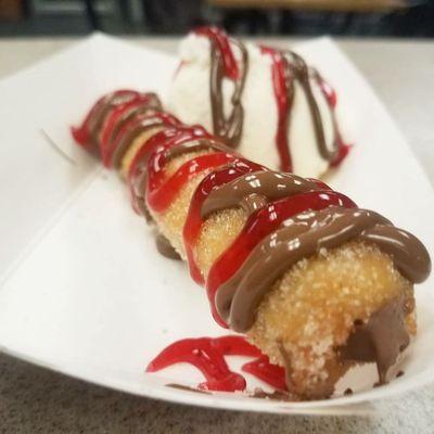 Raspberry topped with nutella and ice cream.