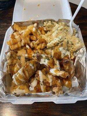 Chicken wing combo with smothered fries and pasta. SOOOOO GOOD!