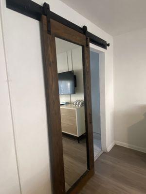 Barn door covers bathroom and closet