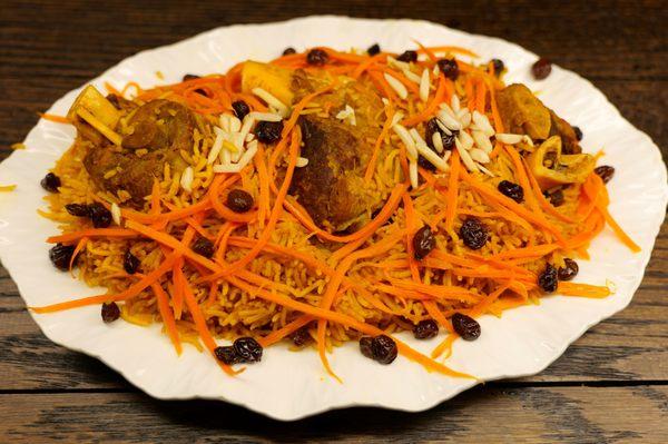 Qabeli Palow:  lamb served with seasoned rice, topped with carrot strips, raisons, and almonds