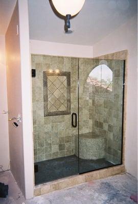 Frameless shower door with oil rubbed bronze hardware $775.00 installed plus tax great service