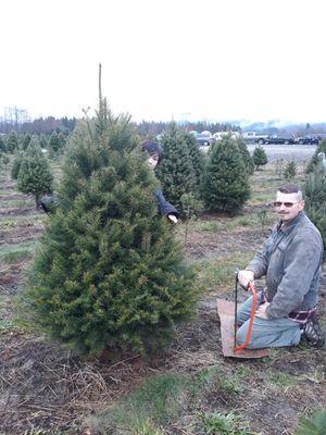 Found our tree and ready to cut it and take it home.