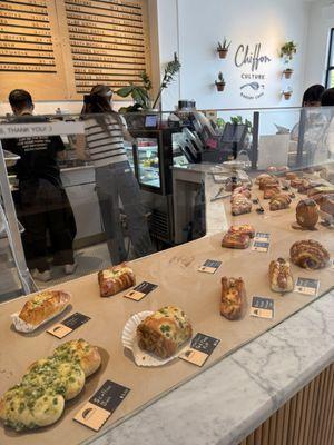 Savory bakery items, food and coffee counter area