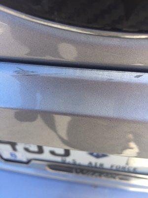 Scratch on rear of car under emblem