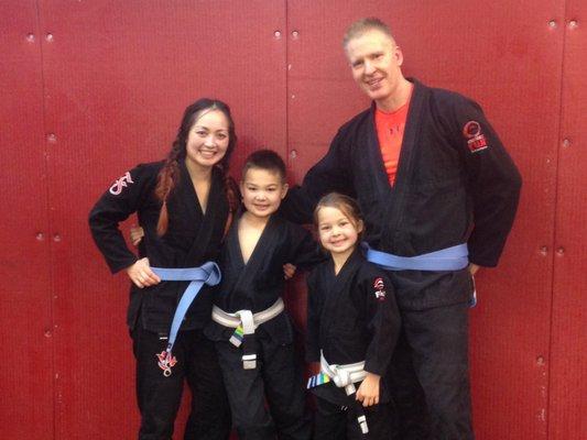 My husband and I after our blue belt Ironman, which our children attended a few years back.