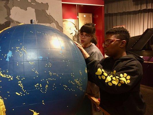 Touch a giant tactile globe.