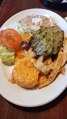 Chicken fajita plate w/ side of refried beans, rice, salad and nopal