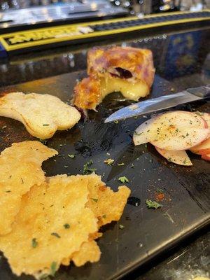 Baked Brie with cranberries, crostini, baked Parmesan chips and apple slices