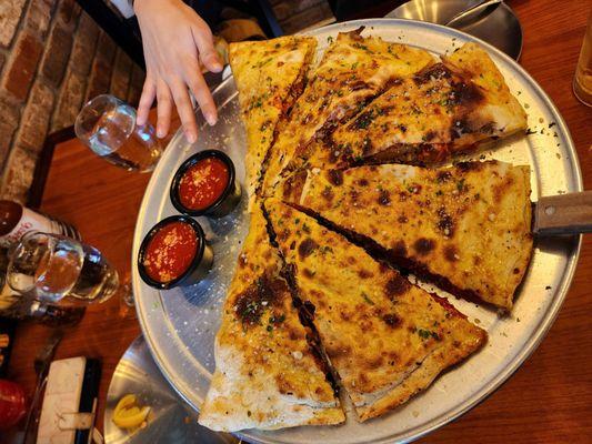 The biggest, tastiest, and the baddest calzone ever!! Look at the size of that thing!!