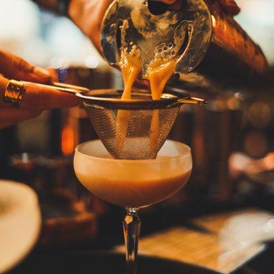 Kofitini maid with our KOFI coffee liqueur being poured.