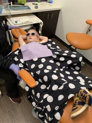 Epitome of 'chilling'! My son's demeanor wasn't always so calm at the dentist.