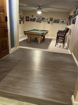 Flooring and pool table.