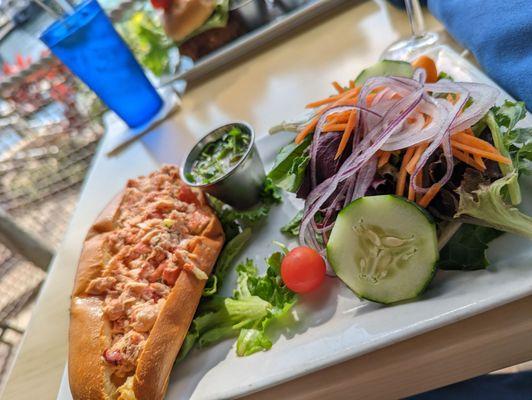 Lobster roll with a side salad