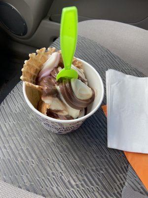 Strawberry, vanilla and chocolate, in a waffle cone.