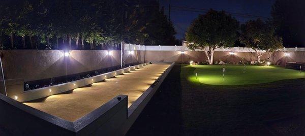 Beautiful complete backyard makeover including building a full length bocce court & putting green. Also did the walls with stucco & lighting