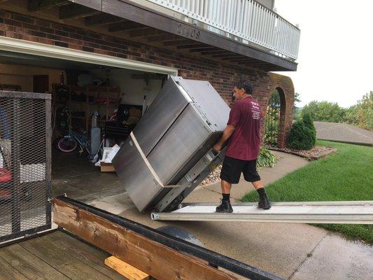 Large double door refrigerator pick up, removal and hauling service in Omaha NE.