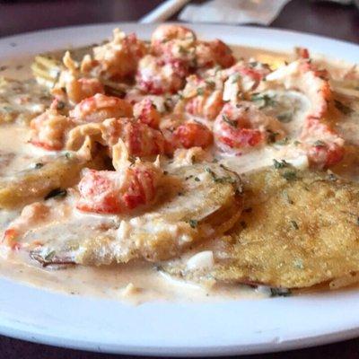 Fried green tomatoes topped with crawfish. Follow my food adventures on IG: @saltnsucar