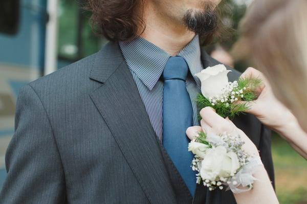 Grooms boutonniere and a grooms-lady's wrist corsage.
 Photo by Juliet Ashley