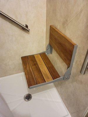 Folding shower seat