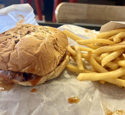 The Super Roast Beef on an onion bun with French fries.