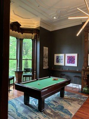 Pool table across the bar and check-in area.