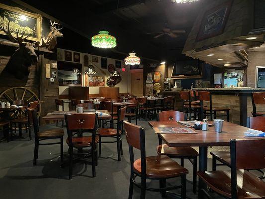 Interior view (bar side), bathrooms are behind the wall with the big moose head.